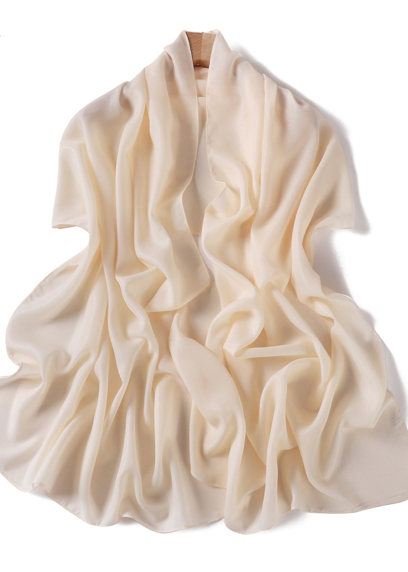 A solid-color flowing chiffon long shawl