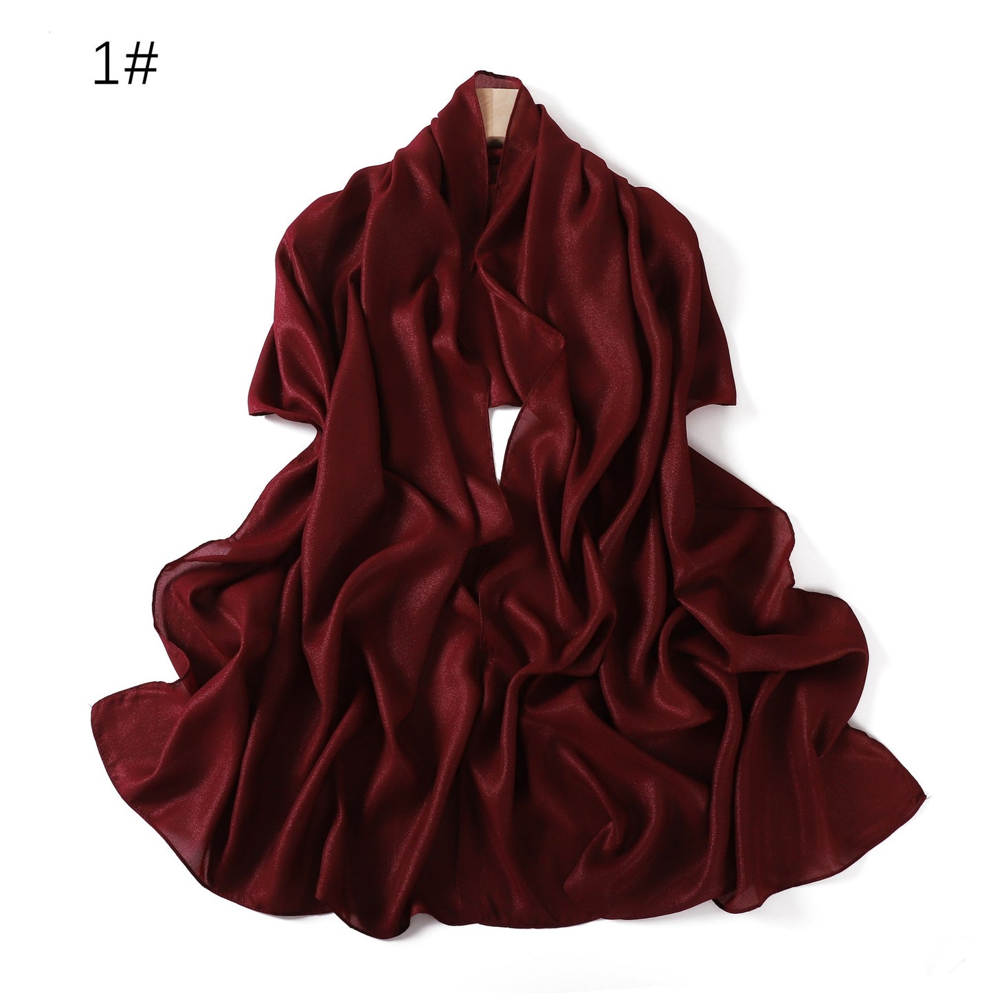 A solid-color flowing chiffon long shawl