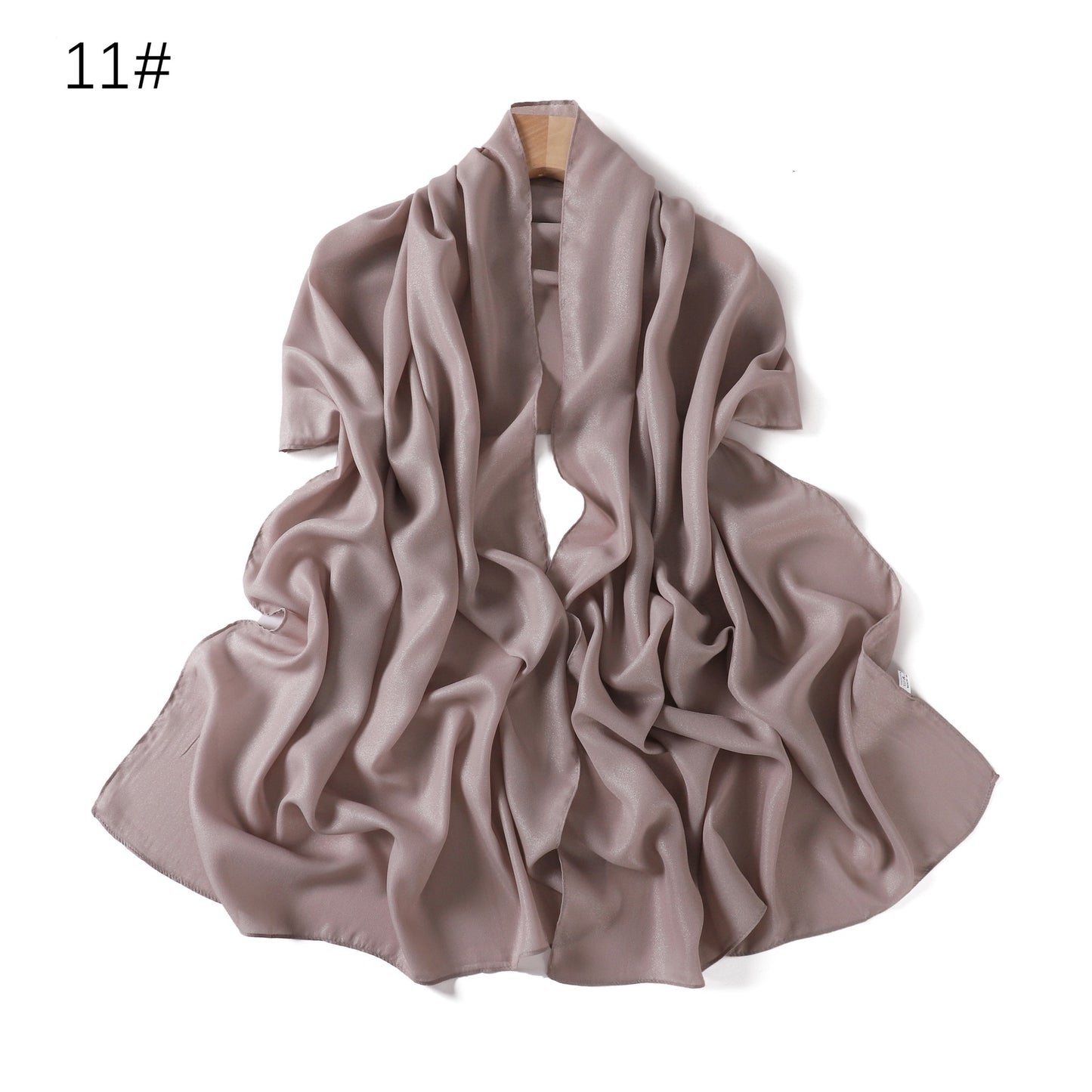 A solid-color flowing chiffon long shawl