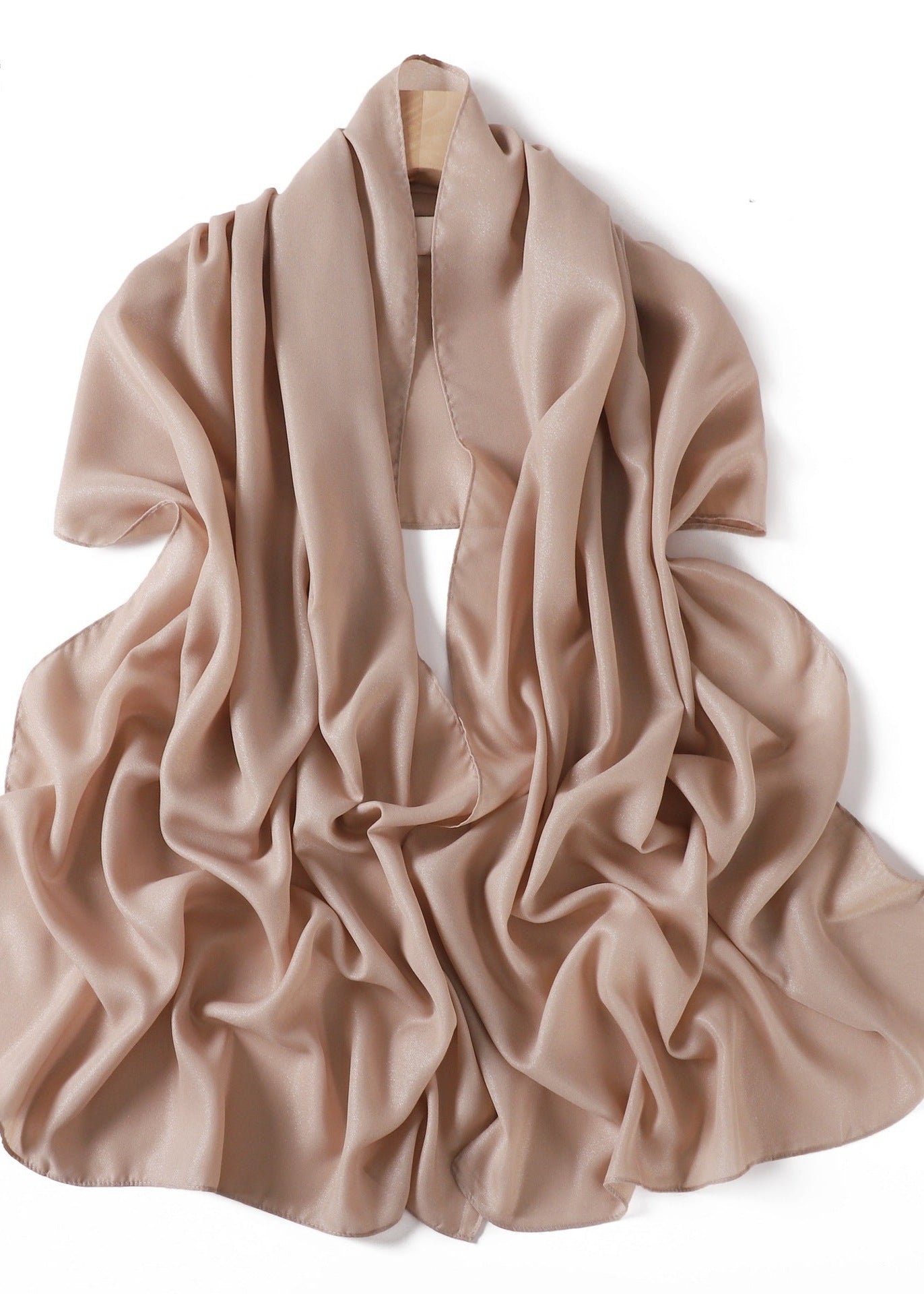 A solid-color flowing chiffon long shawl