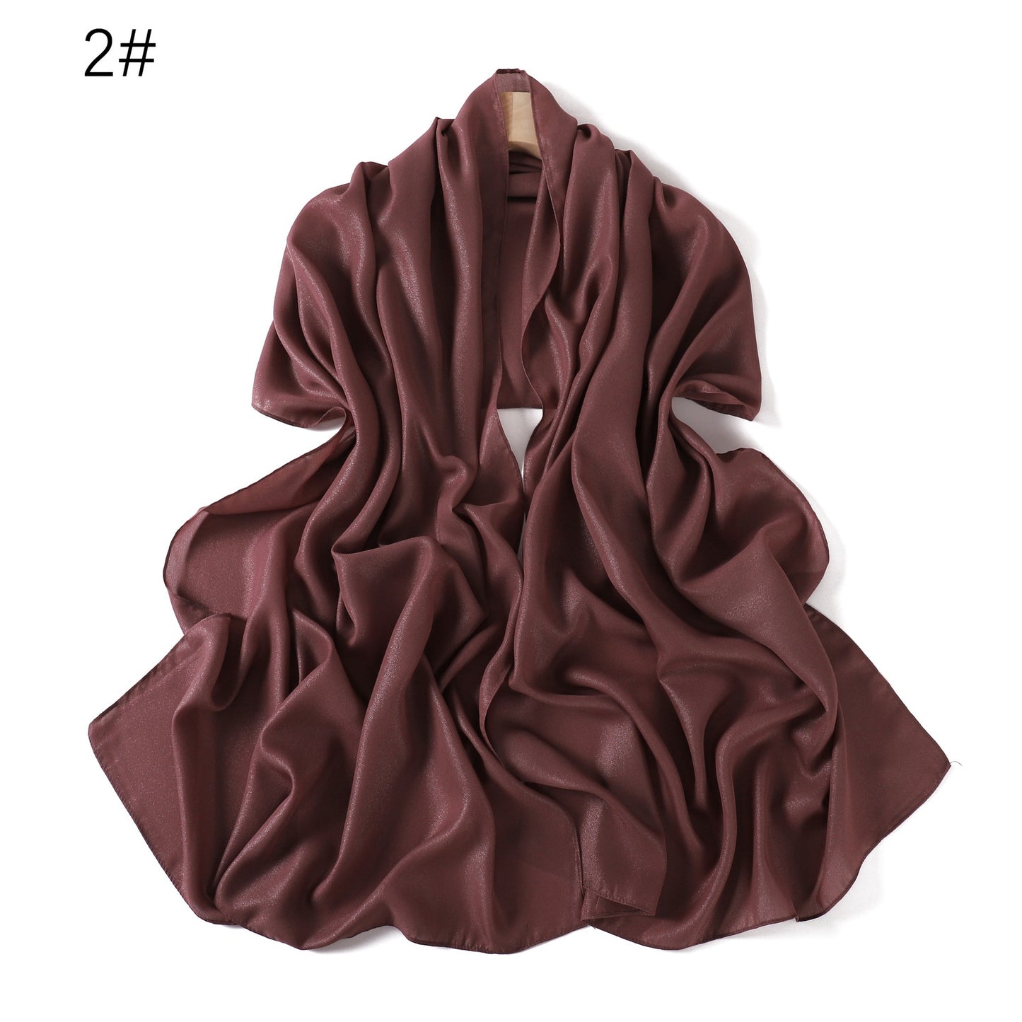 A solid-color flowing chiffon long shawl
