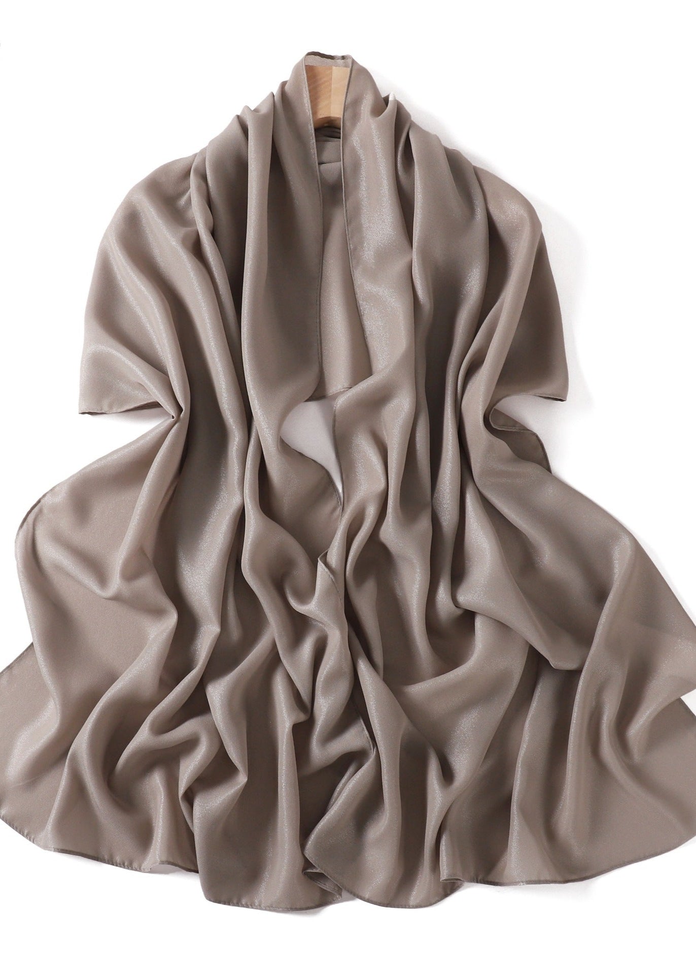 A solid-color flowing chiffon long shawl
