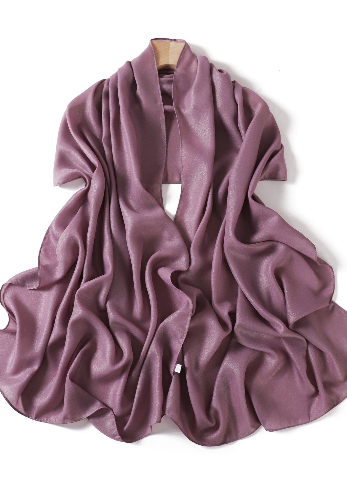 A solid-color flowing chiffon long shawl
