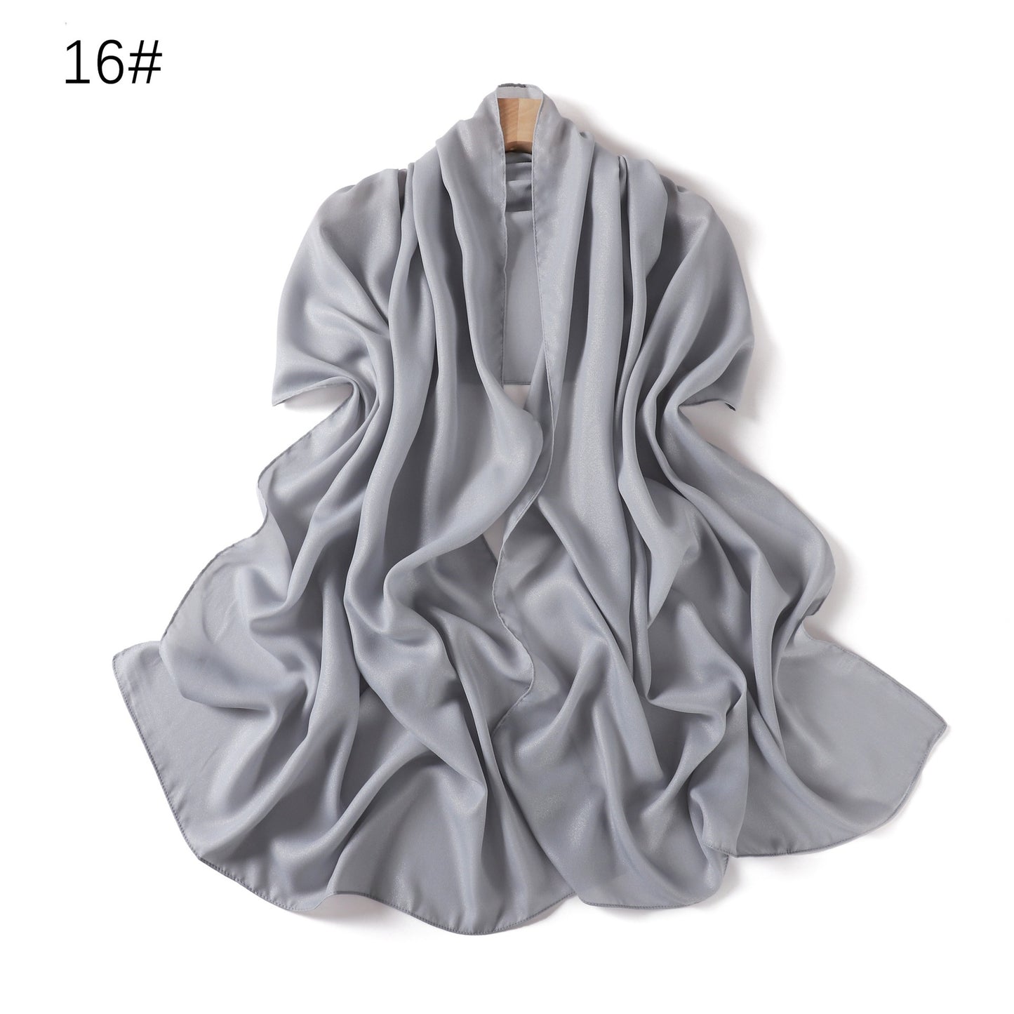 A solid-color flowing chiffon long shawl