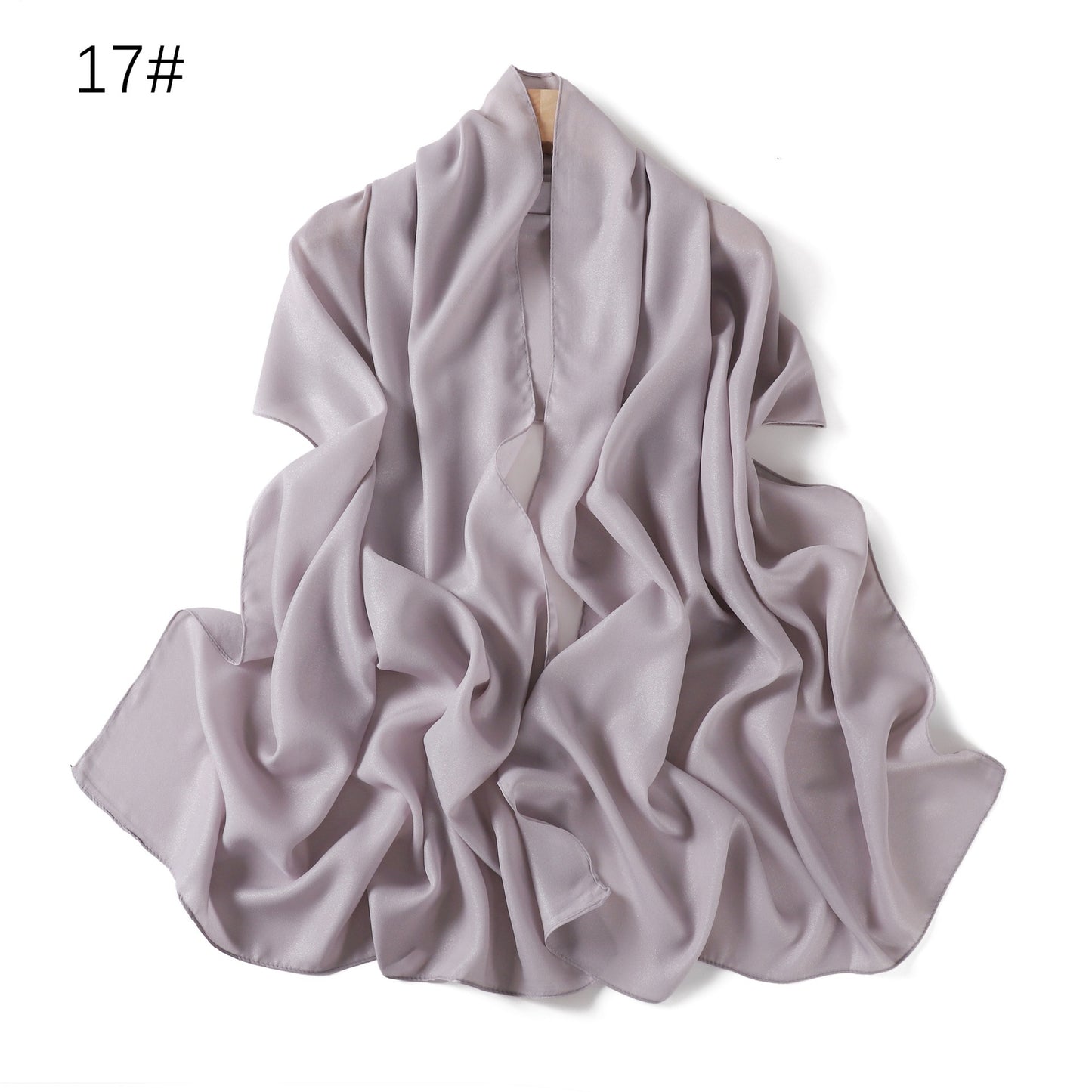 A solid-color flowing chiffon long shawl