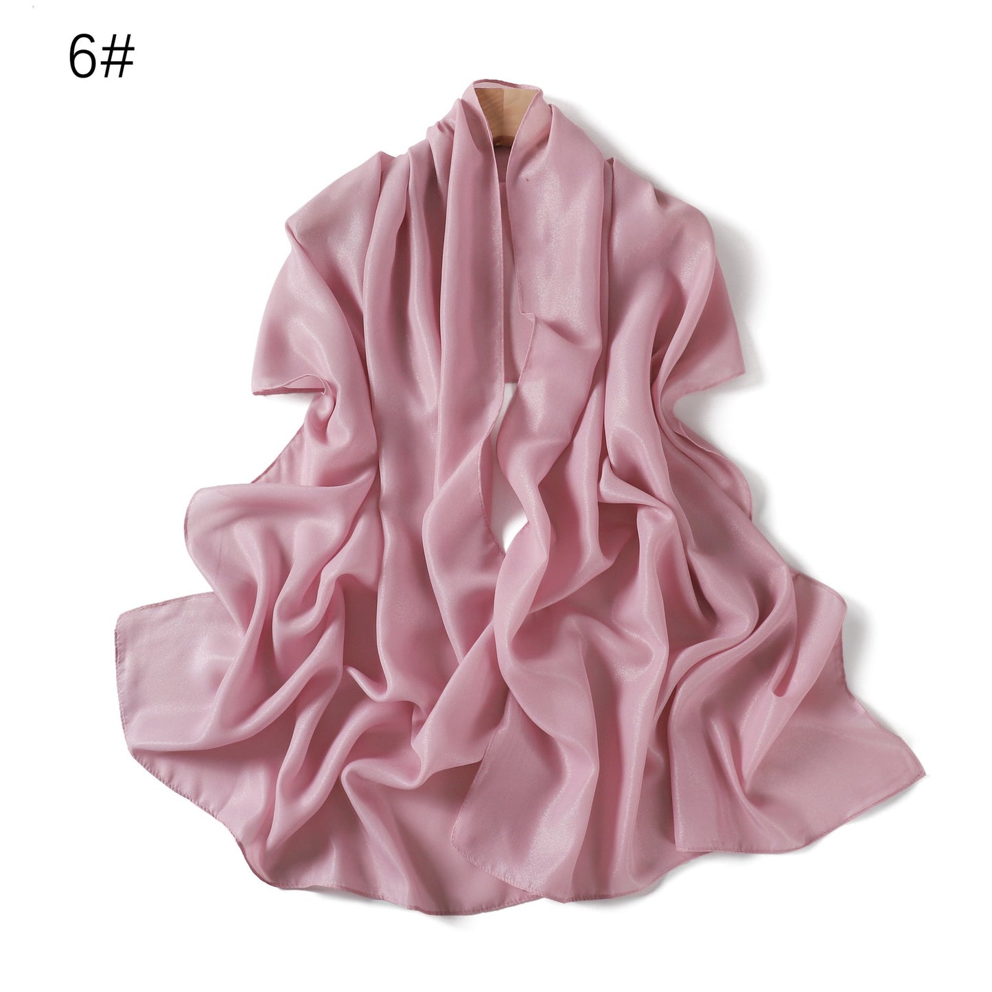 A solid-color flowing chiffon long shawl