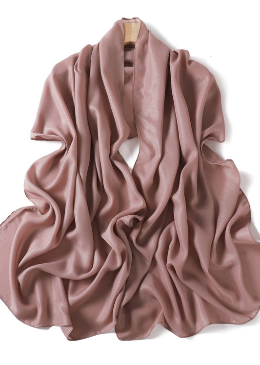A solid-color flowing chiffon long shawl