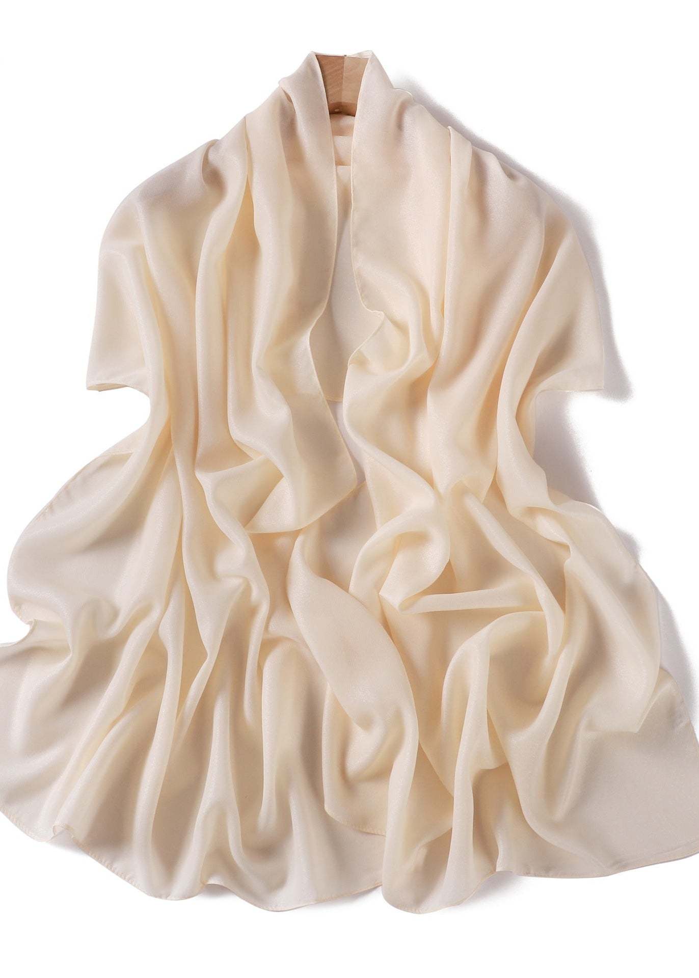 A solid-color flowing chiffon long shawl