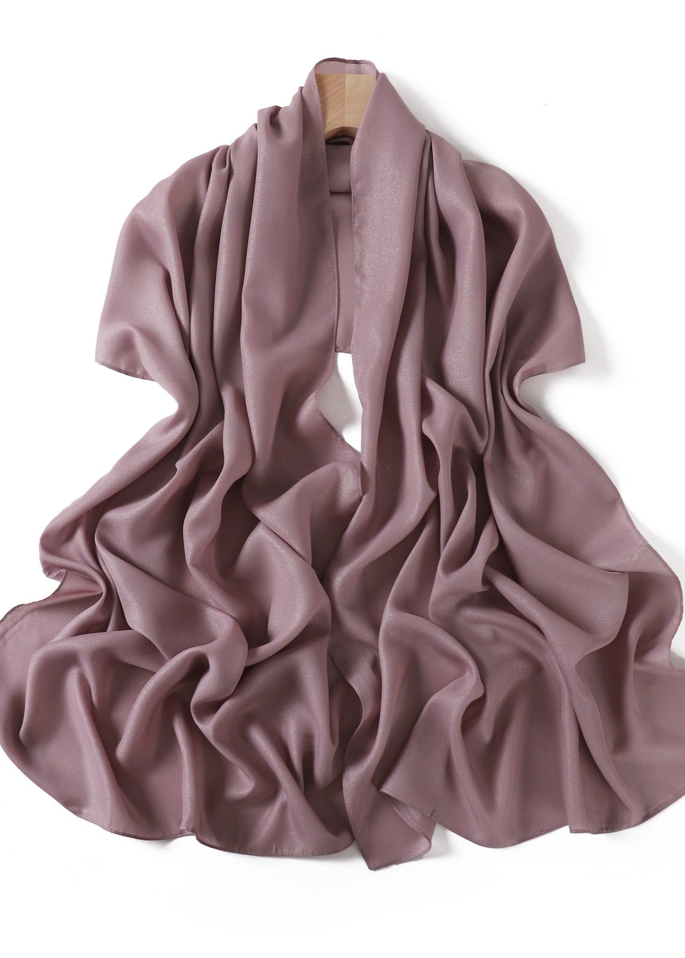 A solid-color flowing chiffon long shawl