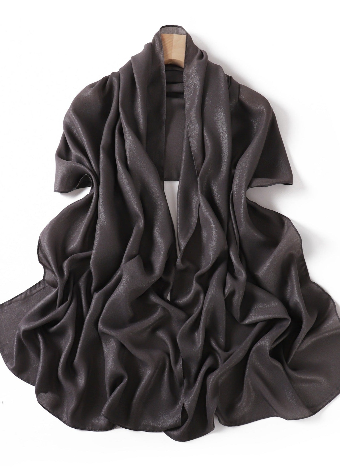 A solid-color flowing chiffon long shawl