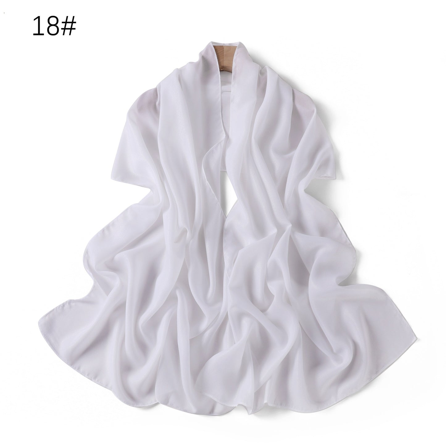 A solid-color flowing chiffon long shawl