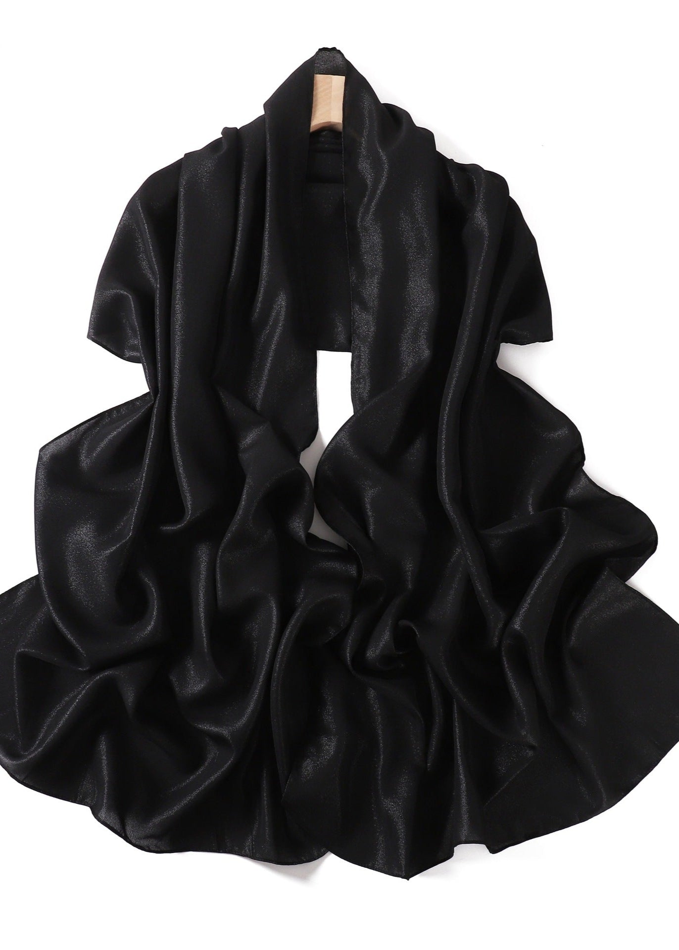 A solid-color flowing chiffon long shawl